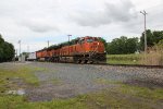 BNSF units lead a Norfolk Southern train through Westfield New York